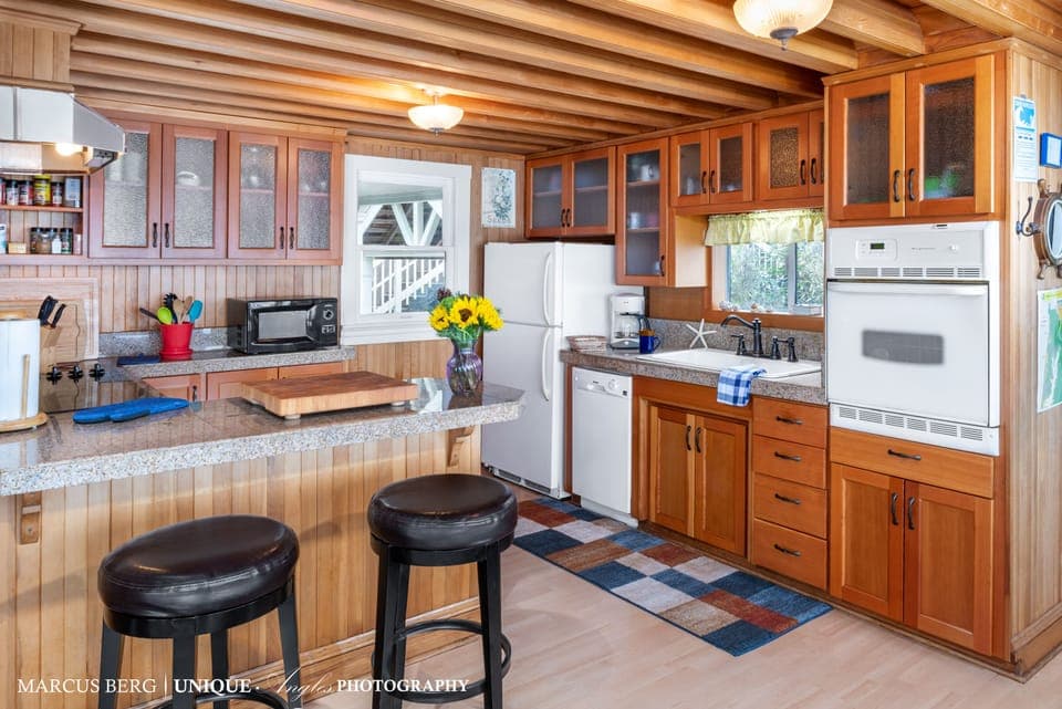 Beachfront Kitchen - Beautiful new fir cabinetry and granite counters.  Every supply you'd need to create a beautiful oceanfront meal for the gang.