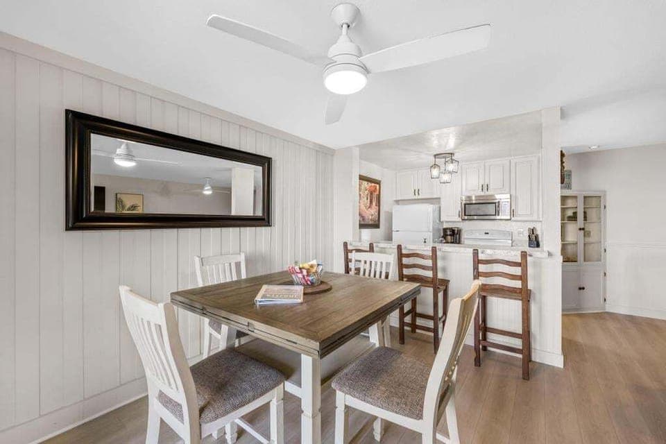 The dining space has enough seating for four guests.