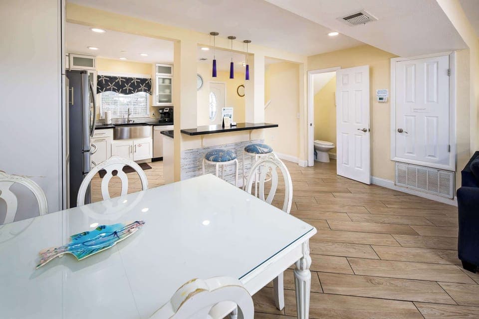 Dining/Kitchen area with half bathroom