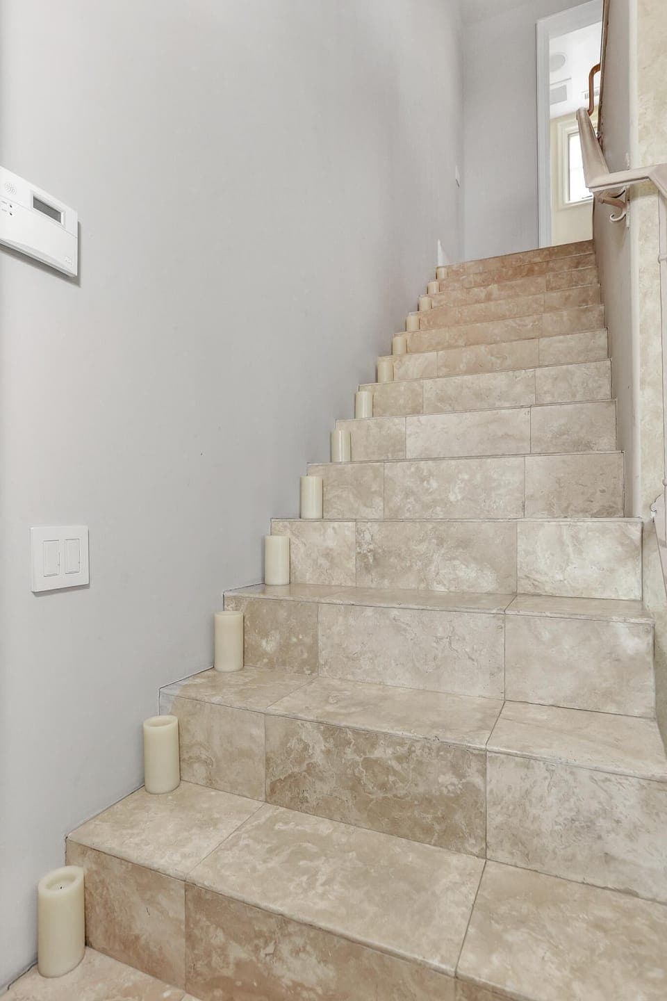 dramatically lit staircase lead to the one bedroom flat on the 2nd level