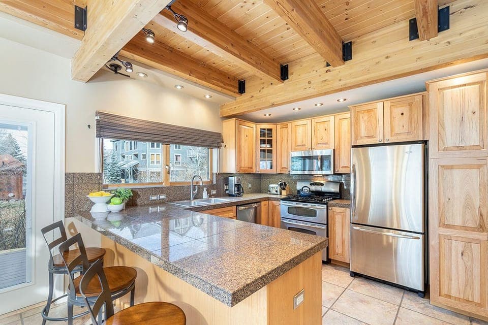 The kitchen is fully equipped for entertaining during your Telluride stay! There is even a "grill window" over the sink for maximum efficiency.