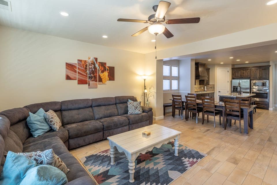View of dining room and kitchen - The Living Room is located adjacent to the dining room and is the perfect place to relax and watch your favorite movie or TV program.