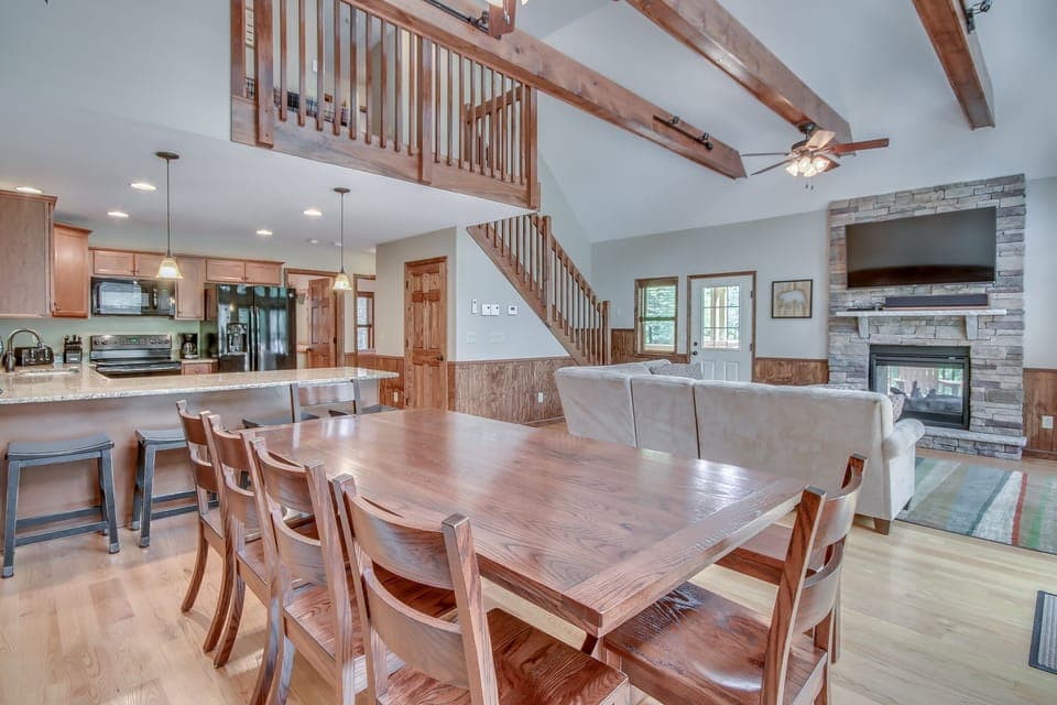 Great Room with TV, Fireplace, and Seating in our Poconos Vacation Rental Home