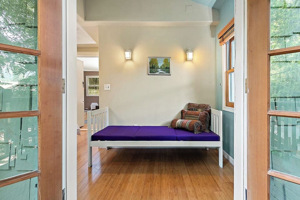 The "mini" bed is great for a kid to share the room with parents.