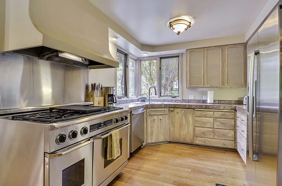 Dacor professional double oven stove in the fully stocked kitchen.