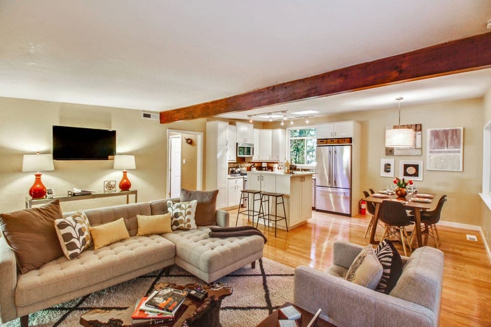 Settle into the living room while laughing with the cook!