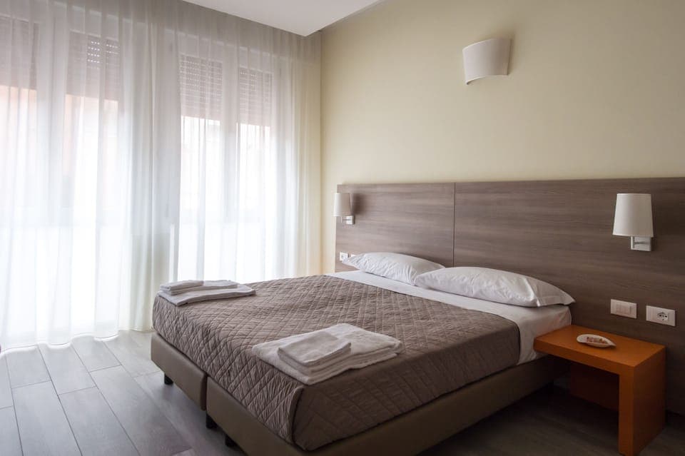 Superior Double or Twin Room, Private Bathroom, City View | Minibar, in-room safe, desk, iron/ironing board