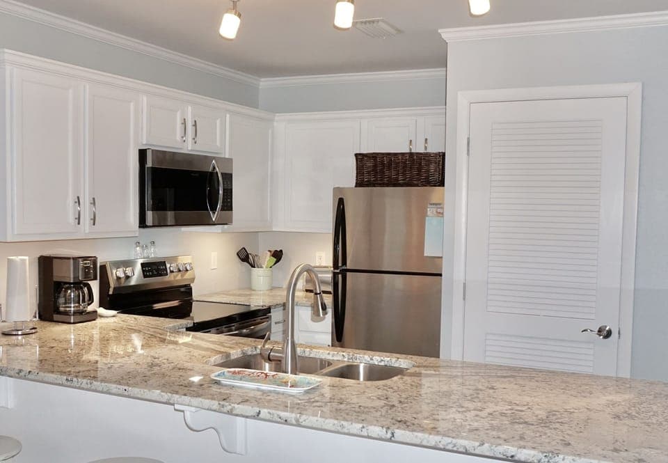 Totally remodeled kitchen features  granite countertop and stainless appliances
