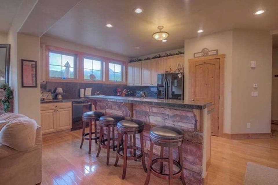 Kitchen: Drip coffee maker, Crockpot, blender, cooking utensils, tableware