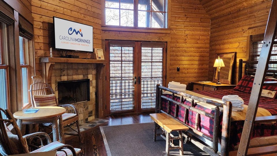 Main Level Living Area w/ Wood Burning Fireplace & King Bed