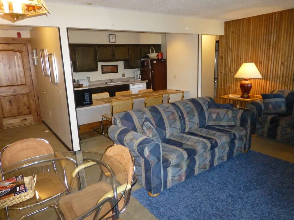 Facing sofa sleeper, kitchen and entrance way. 