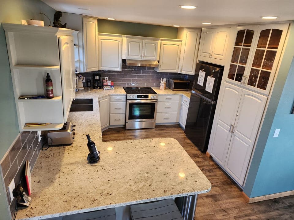 Kitchen with granite countertops and new appliances (August 2023)