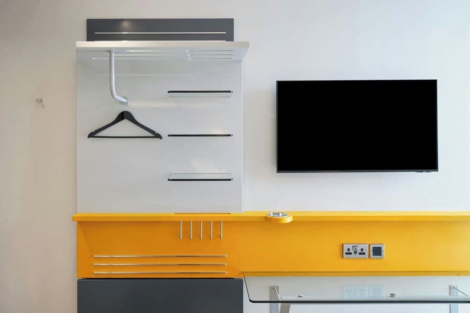 Desk, laptop workspace, blackout drapes, iron/ironing board