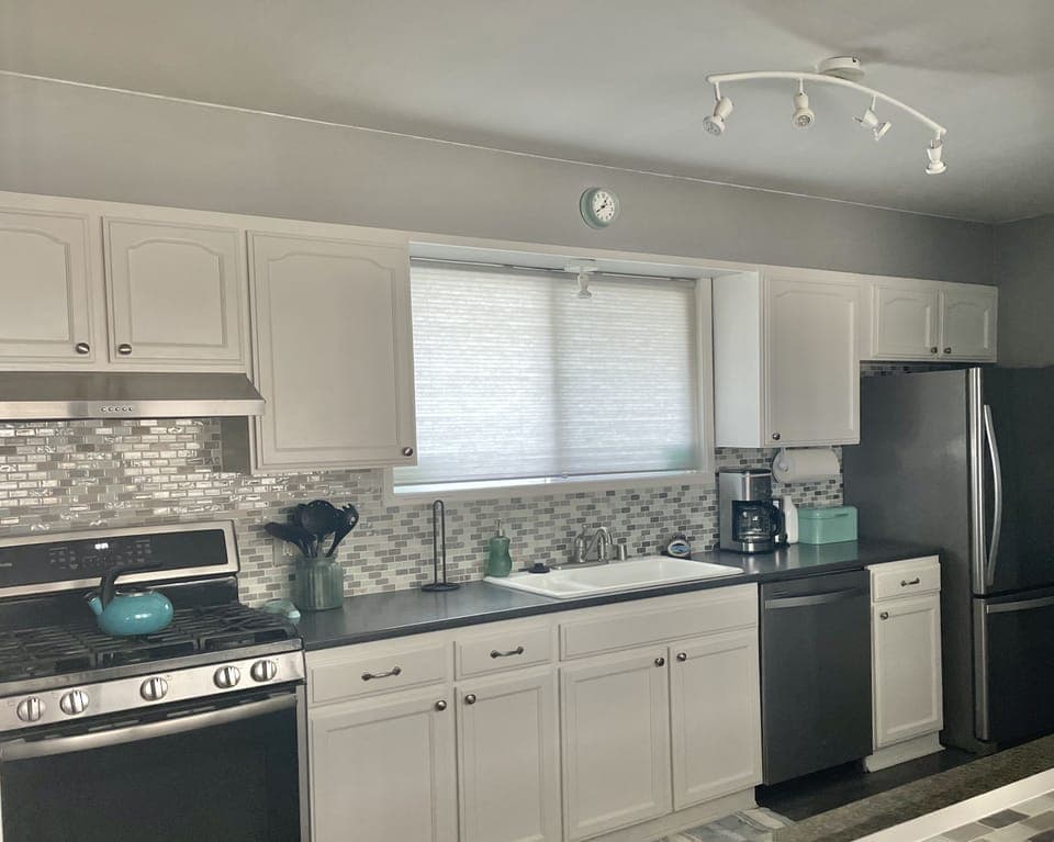 View of one side of the kitchen from great room and bar area