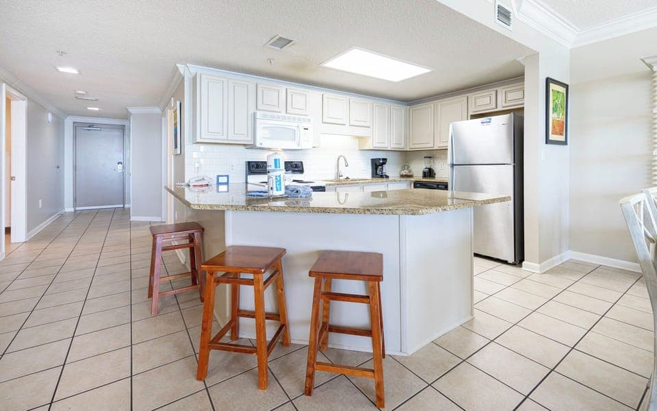 Spacious kitchen bar with seating, perfect for casual meals or coffee and enjoying the open layout