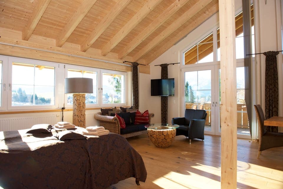 Deluxe Suite, 1 King Bed, Bathtub, Mountain View | Living area | Flat-screen TV