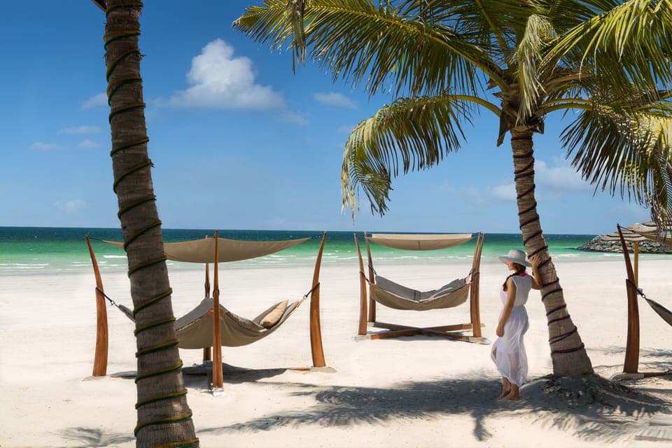 Private beach, white sand, sun loungers, beach umbrellas