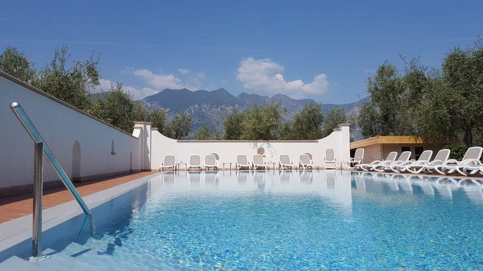 Outdoor pool, open 8:00 AM to 8:00 PM, sun loungers