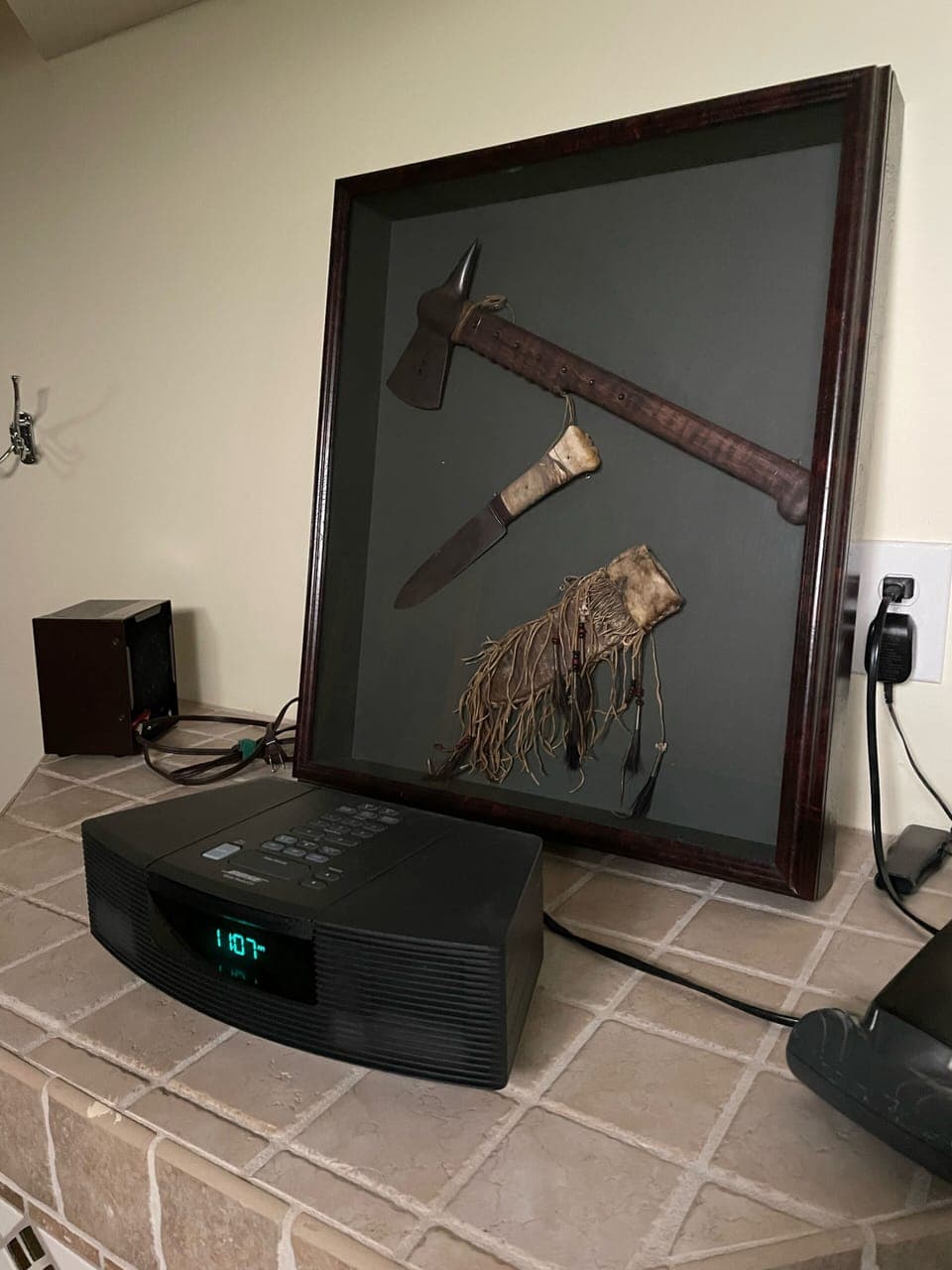 Bose radio/cd player with replica “Last of the Mohicans” knife and tomahawk. 