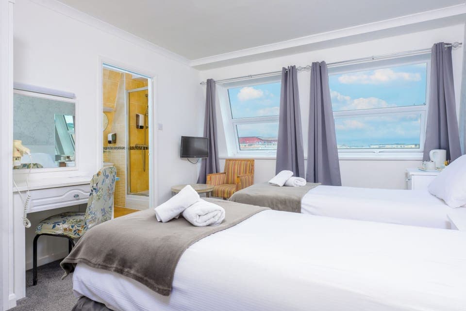 Twin Room | Desk, iron/ironing board, bed sheets