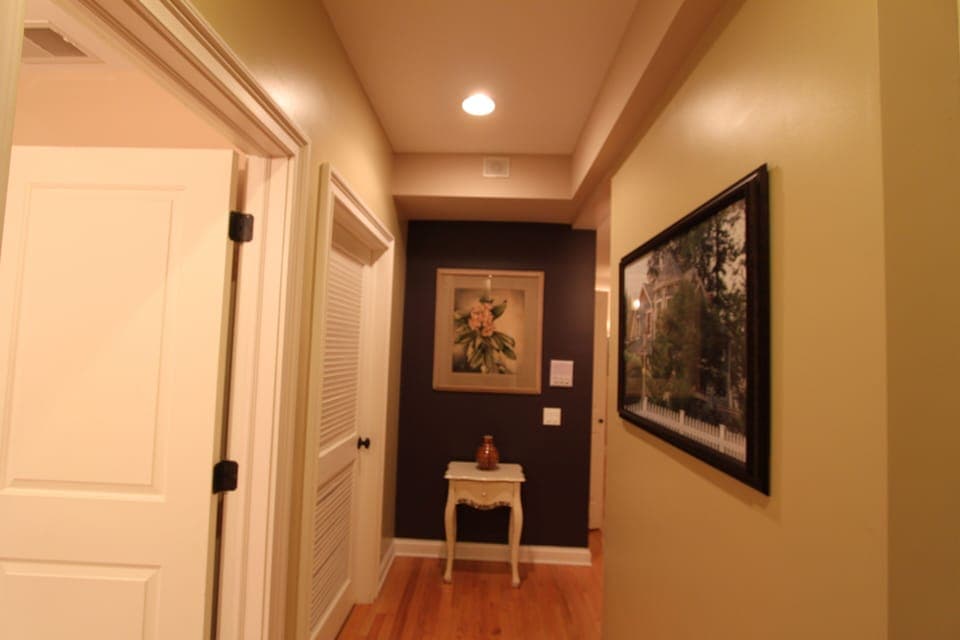 The front hall bathroom to the left. This hall leads to the private bedroom hall