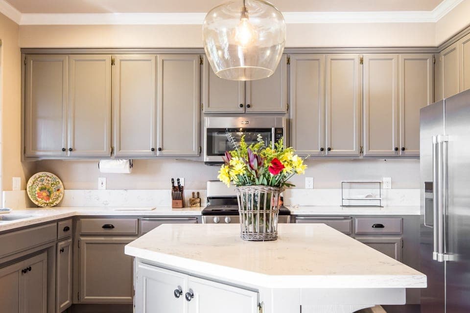Updated & Fully Stocked Kitchen with Quartz Countertops &