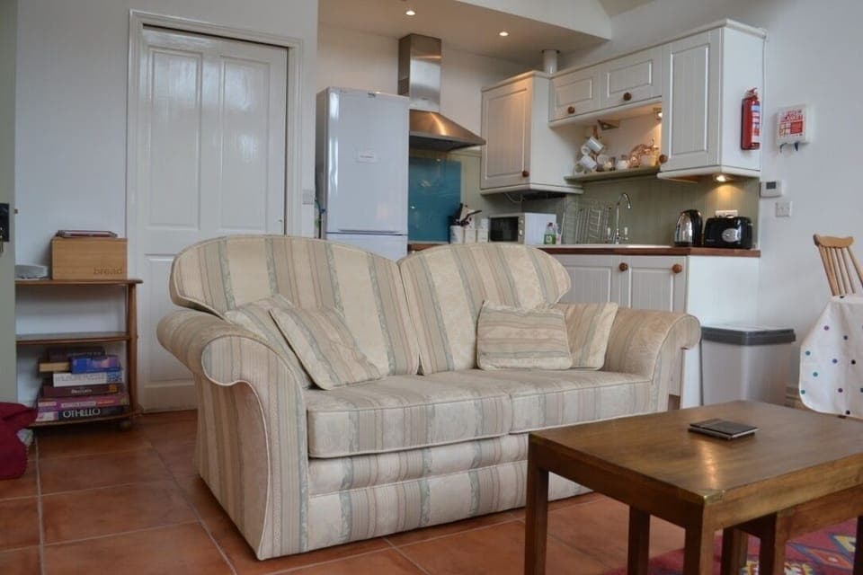 living area with kitchen behind