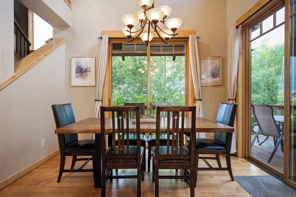 Dining room table with room for six and patio access