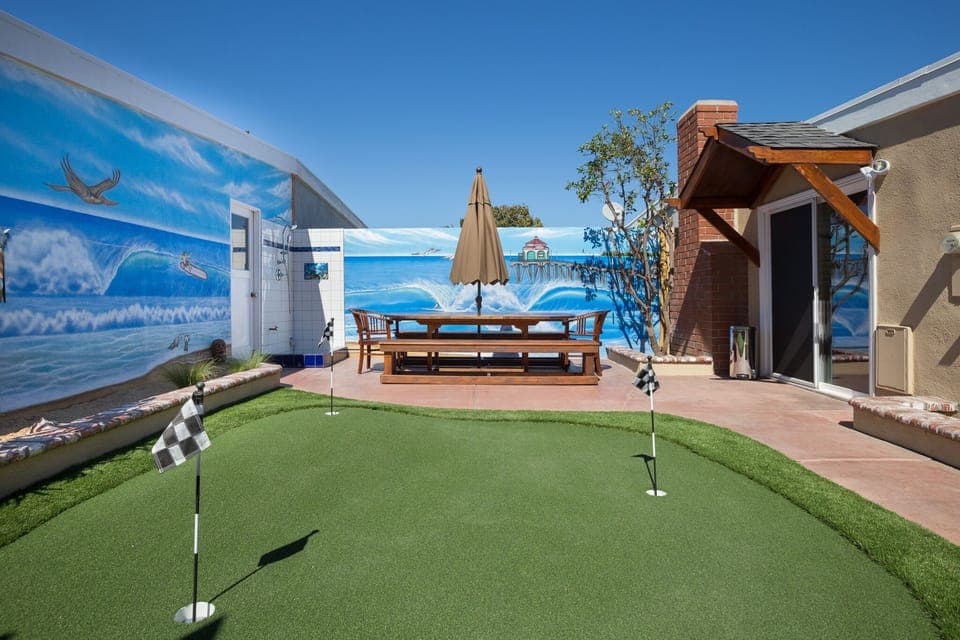 Teak Table is 8 feet and seats 10 with an umbrella. Putting Green