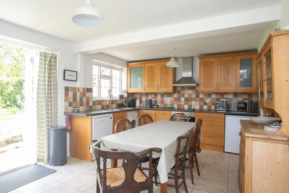 The cottage has a modern kitchen/diner that opens on to the garden.