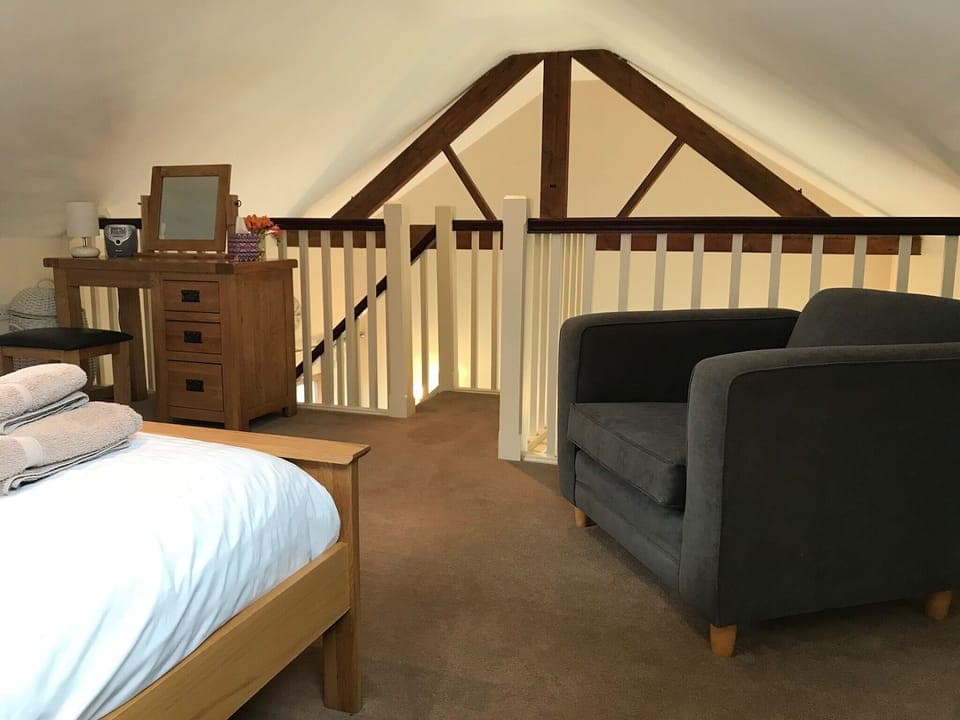 Upstairs galleried bedroom with king size bed