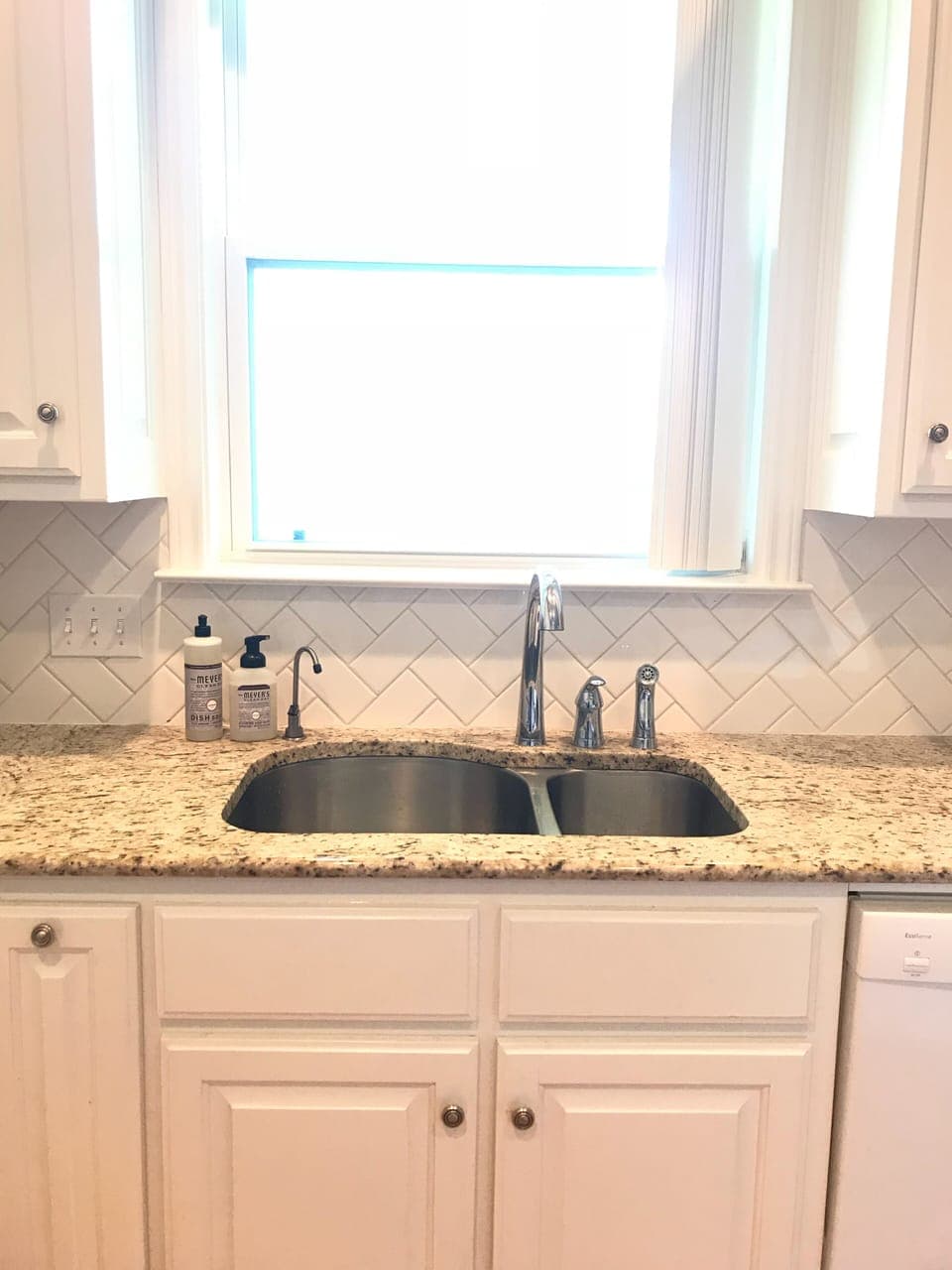 Kitchen faces large backyard.