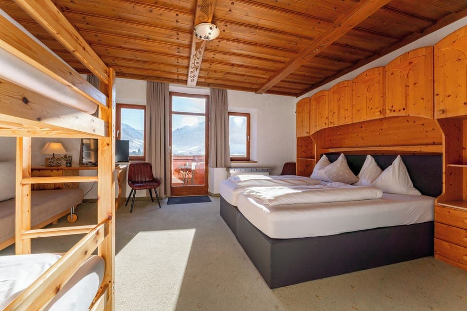 Family Room | Premium bedding, down comforters, in-room safe, desk