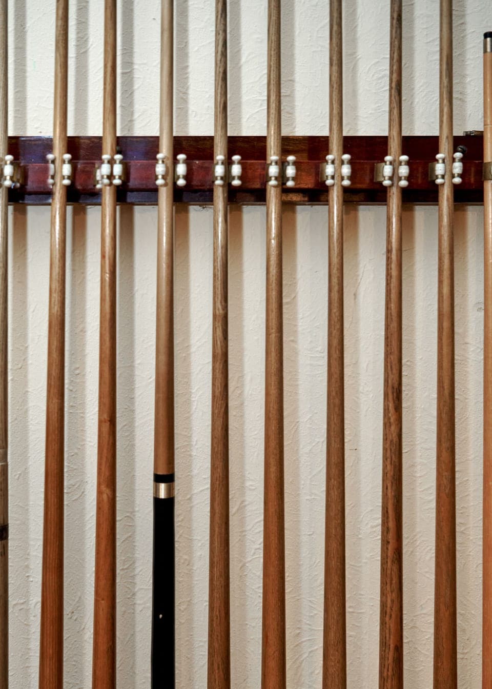 The cue sticks in the billiard room of Burgie House.