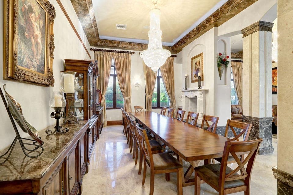 Formal dining room seating 14 people w/ fireplace off the formal seating area