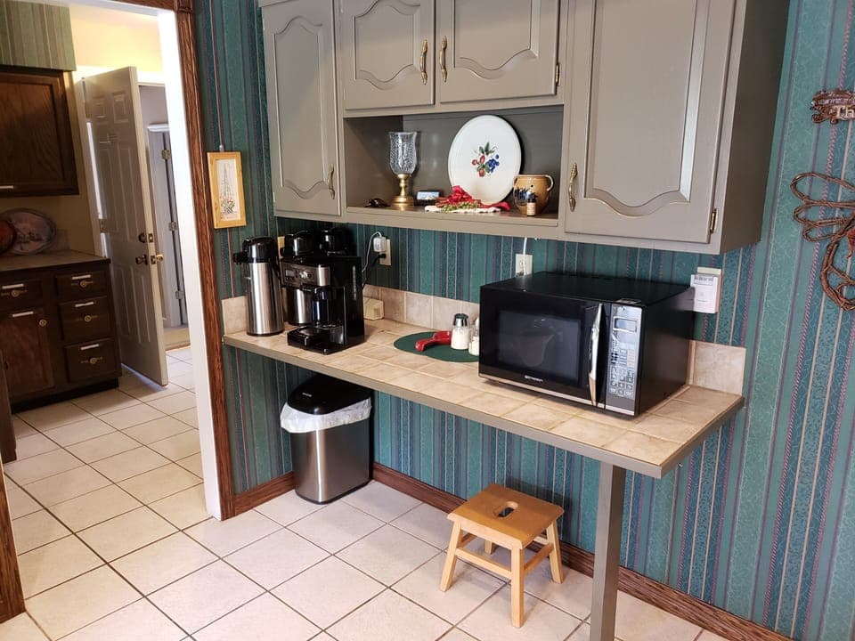 Kitchen coffee bar.  Note entrance to Executive Suite rear left in hallway.  