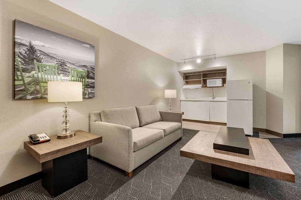 Family Suite, 1 King Bed with Sofa bed, Non Smoking | Desk, laptop workspace, blackout drapes, iron/ironing board