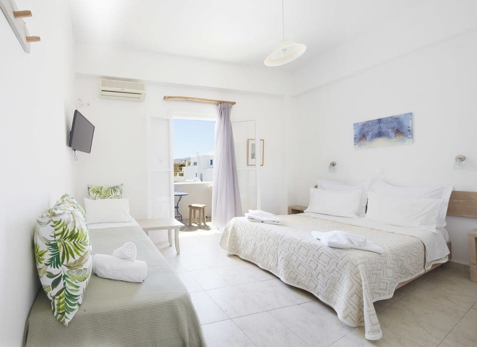 Triple Room, Garden View | Minibar, desk, iron/ironing board, free WiFi