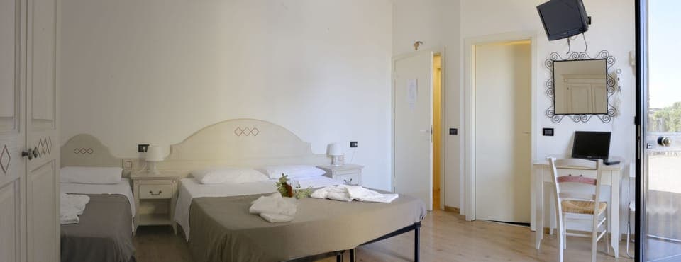 Triple Room, Private Bathroom | Down comforters, desk, free WiFi, bed sheets