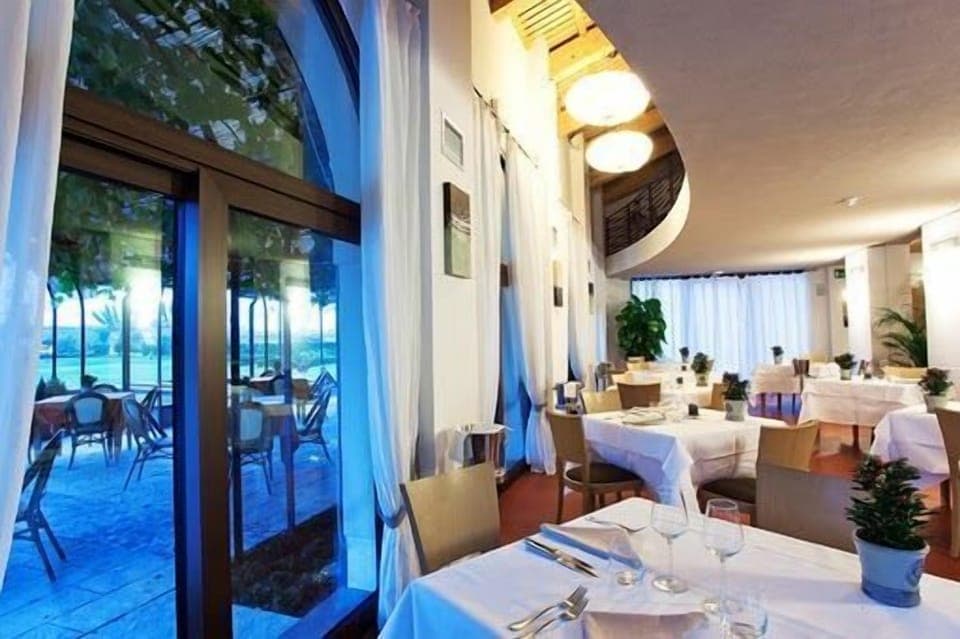 Breakfast, lunch, dinner served; Italian cuisine, garden views 