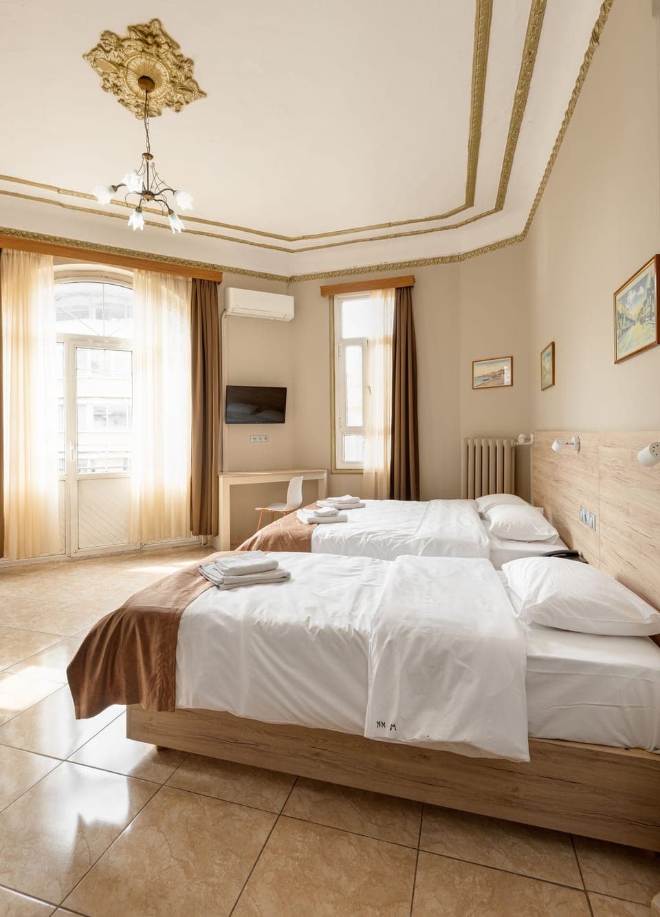 Standard Triple Room | Minibar, in-room safe, desk, soundproofing