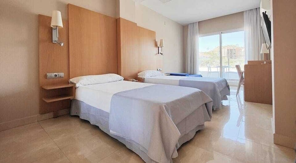 Double or Twin Room, Partial Sea View | 1 bedroom, minibar, desk, blackout drapes