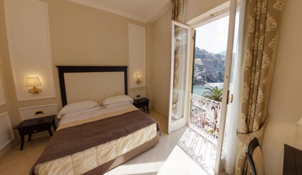 Suite, Sea View (beach access included) | Down comforters, minibar, in-room safe, desk