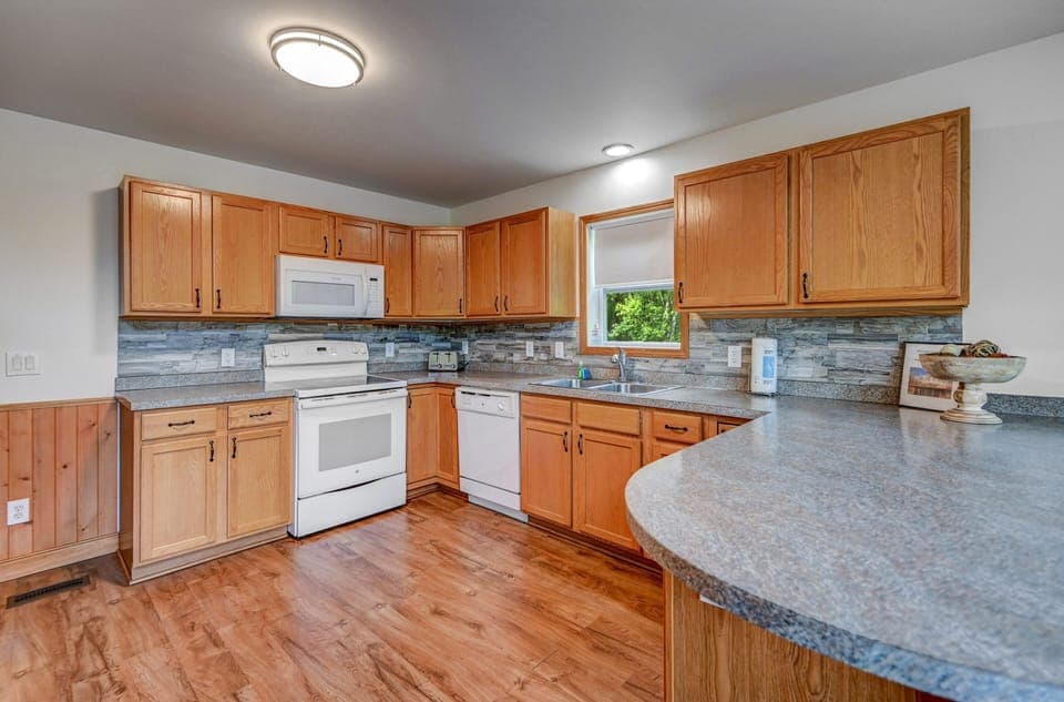  Kitchen with pots, pans, utensils, crockpot, blender, mixer, bowls,cups, plates
