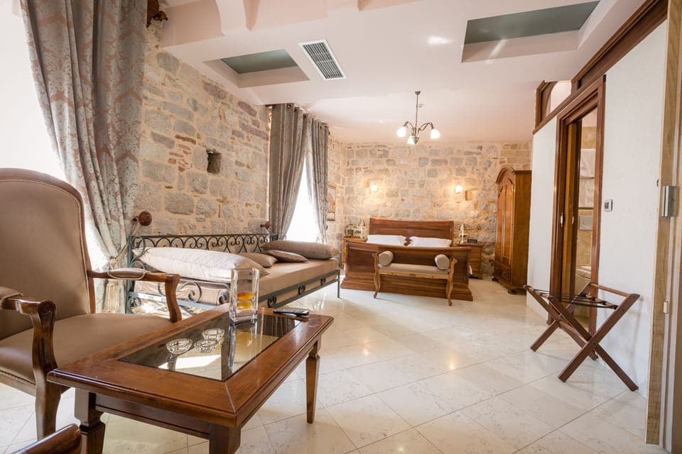 Luxury Suite | Minibar, in-room safe, individually decorated, individually furnished