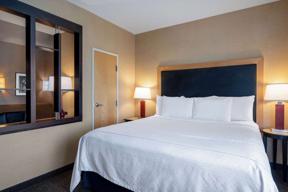 Suite, Multiple Beds, Non Smoking (1 King Bed & 1 Queen Bed) | Desk, laptop workspace, blackout drapes, iron/ironing board