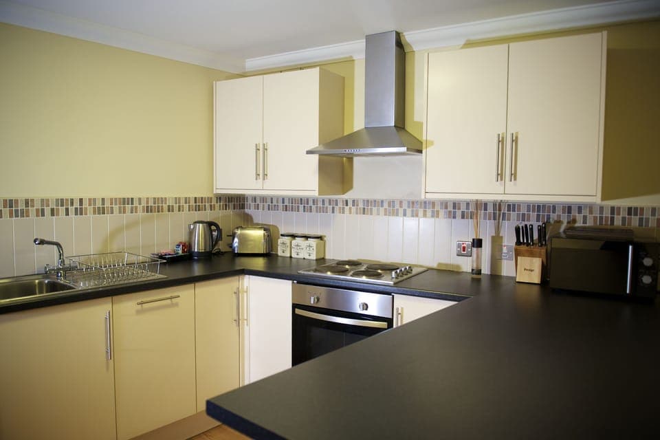 Family Apartment, 1 Bedroom | Private kitchen | Coffee/tea maker