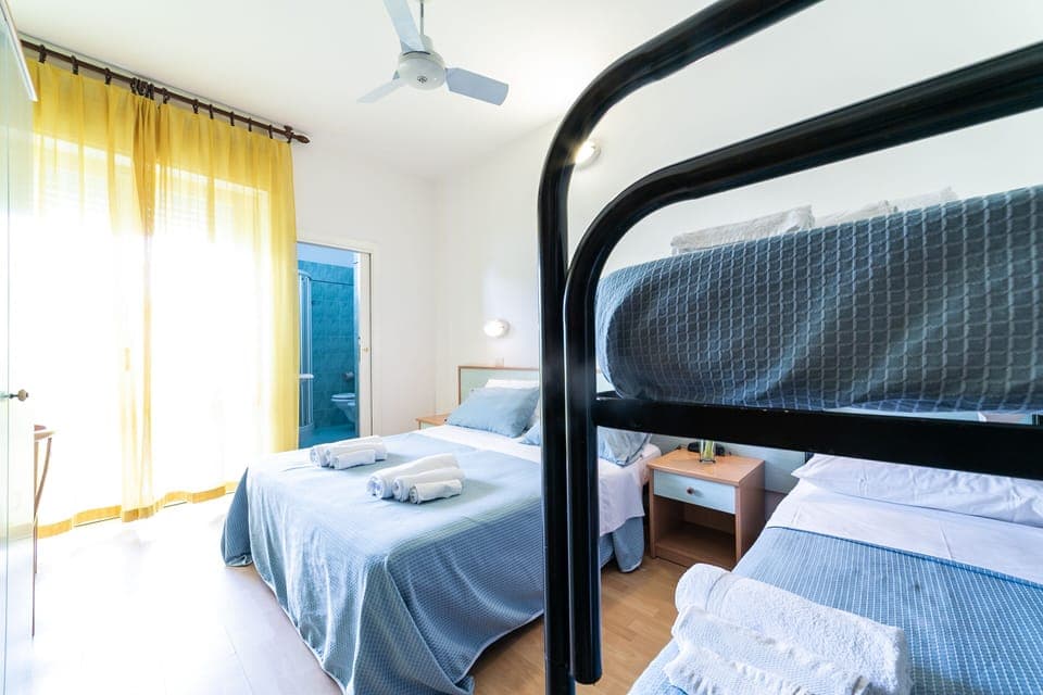 Quadruple Room | In-room safe, desk, free WiFi, bed sheets