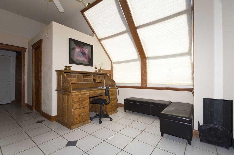 rear entry from garage  With desk area, 1/2 bath and washer dryer (the ski room)