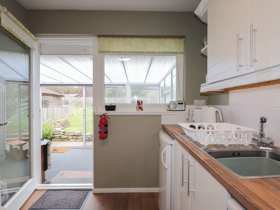 Cottage | Private kitchen | Stovetop, dishwasher, highchair, cookware/dishes/utensils